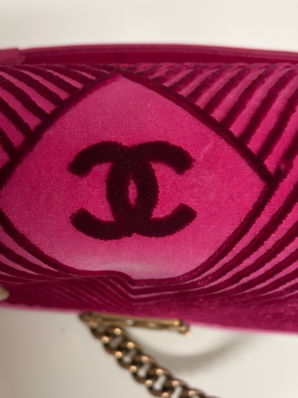 Chanel Boy Flap Bag in pink velvet with chevron quilting and gold-tone hardware.
